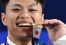Lifter Indonesia Rahmat Erwin Abdullah pecahkan rekor dunia kelas 75Kg Asian Games 2026
